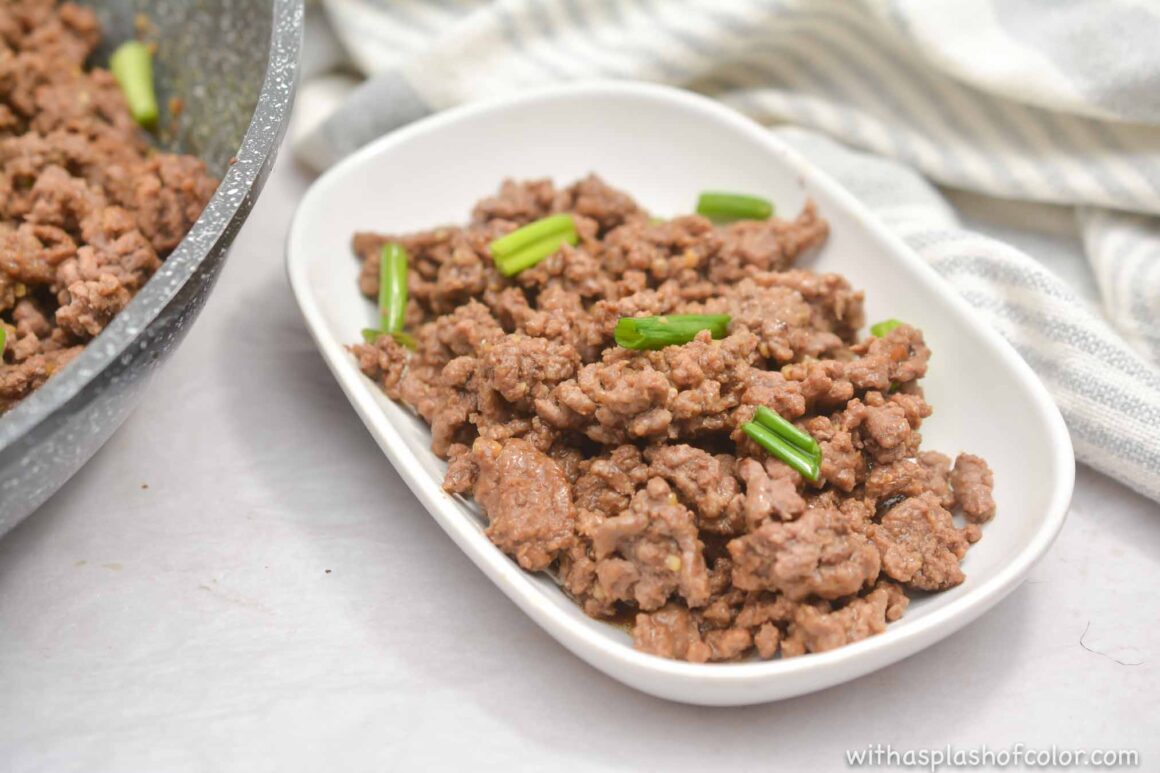 bowl of mongolian beef with green onions.